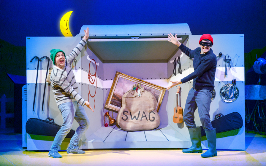 Two actors in a playful heist scene from "What The Ladybird Heard" stage show.