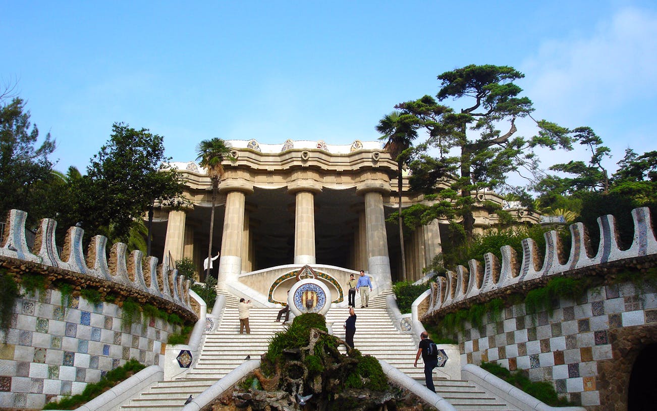 Park Güell entrance with mosaic steps and columns, Barcelona.