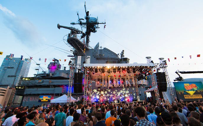 Crowd enjoying a concert at Intrepid's Freedom Festival on the aircraft carrier in New York City.