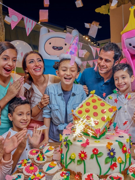 Children celebrating a birthday with themed characters at IMG Worlds of Adventure.