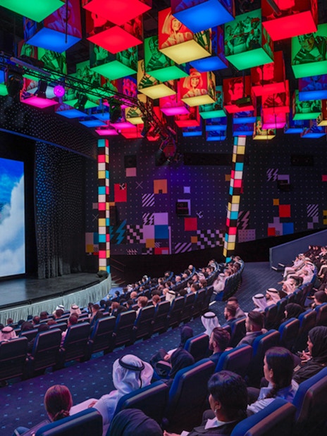 Audience watching a presentation at IMG Worlds of Adventure theater.