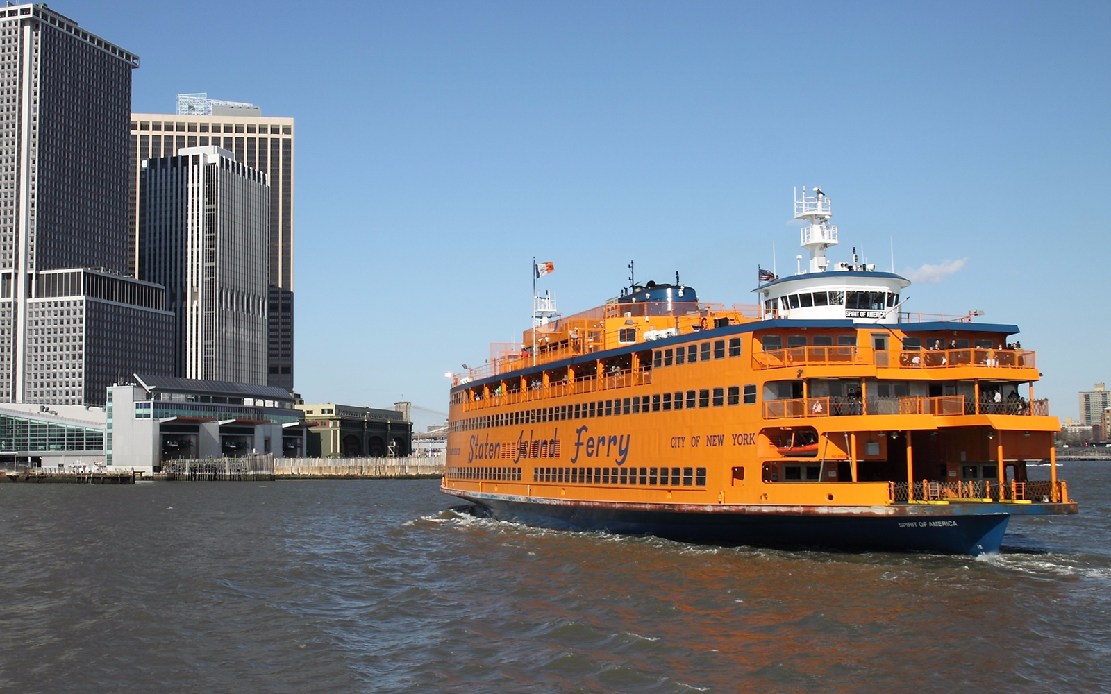 Staten Island Ferry approaching Manhattan skyline, part of Amazing New York Package.