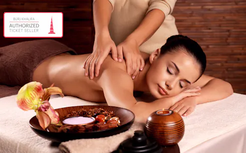 Spa treatment at The Burj Club with a relaxing massage and aromatherapy setup.