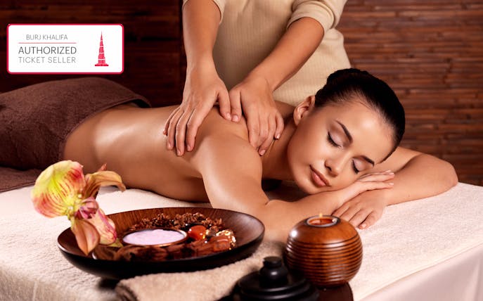 Spa treatment at The Burj Club with a relaxing massage and aromatherapy setup.