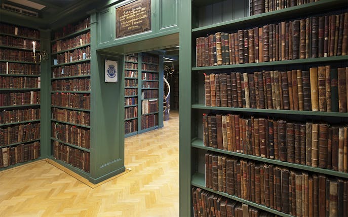 Library with shelves of old books in the Jewish Cultural Quarters tour.