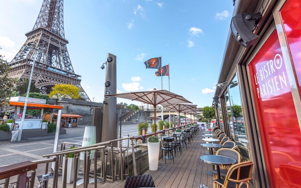 Le Bistro Parisien terrace with Eiffel Tower view, Paris, France.