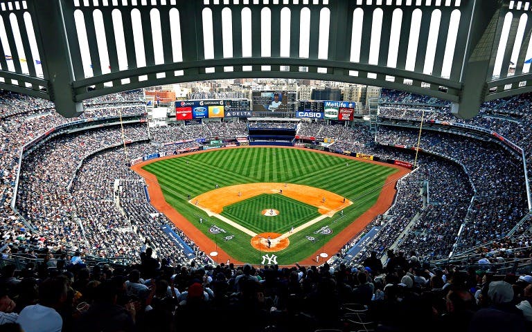Yankee Stadium view during a baseball game, showcasing the field and crowd.