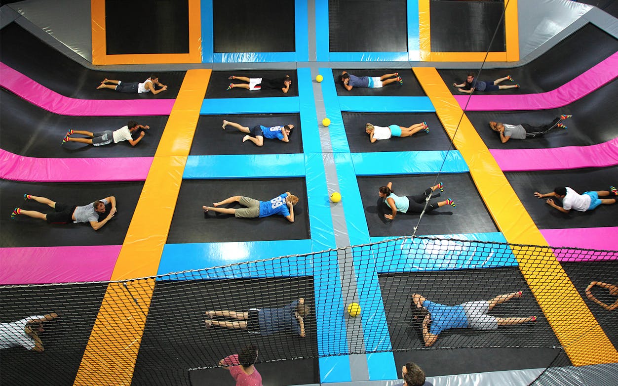 People enjoying trampoline activities at Bounce Dubai indoor park.