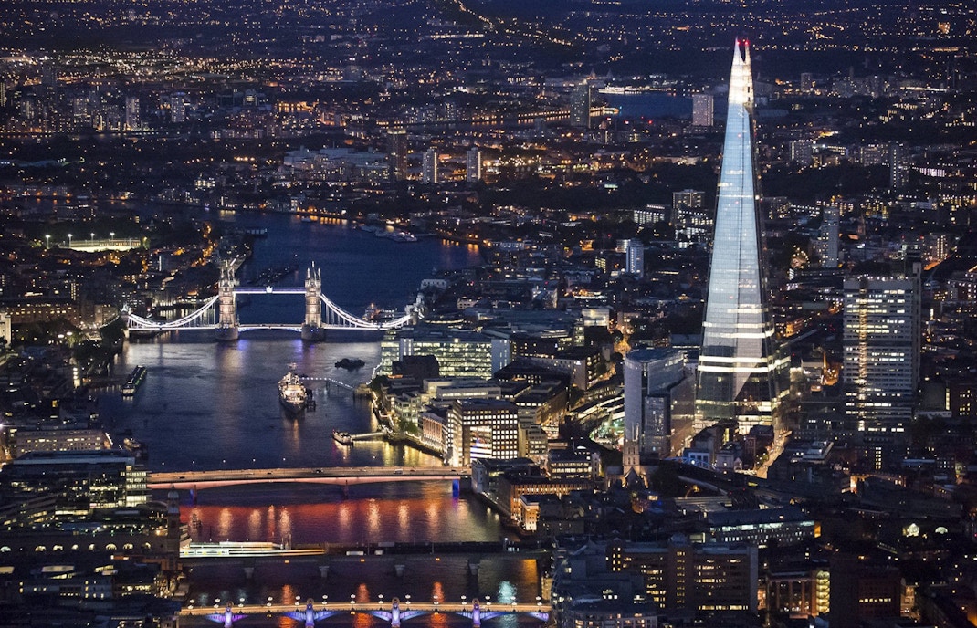 Aerial view of the Shard and Tower Bridge at night, London, for Thames Cruise and Shard tour.
