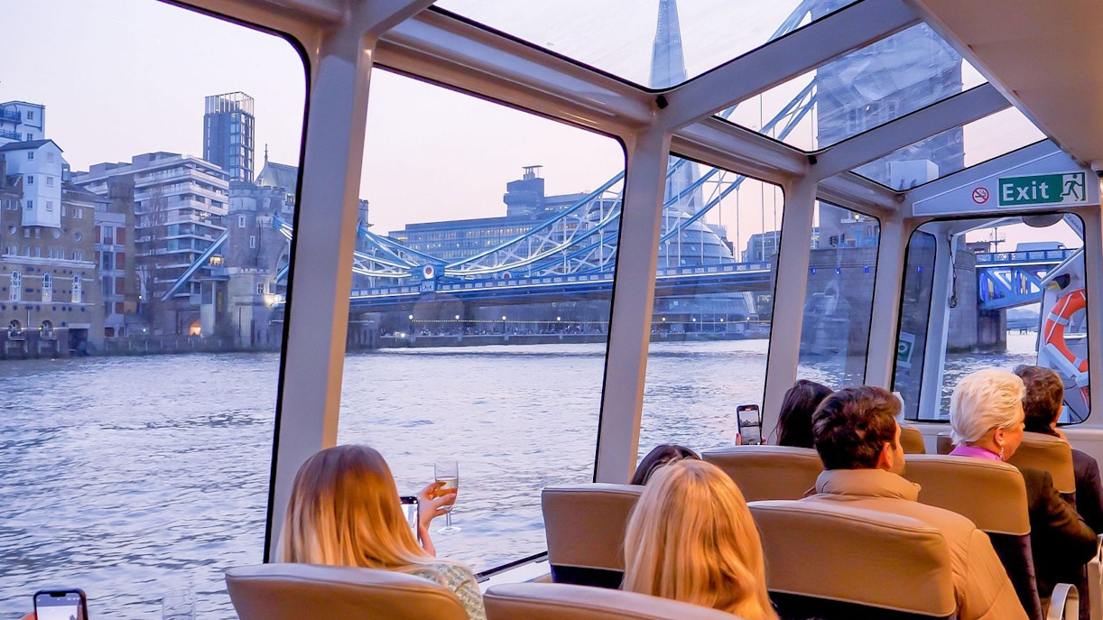 Cruise passengers view Tower Bridge and The Shard on Thames River, London.