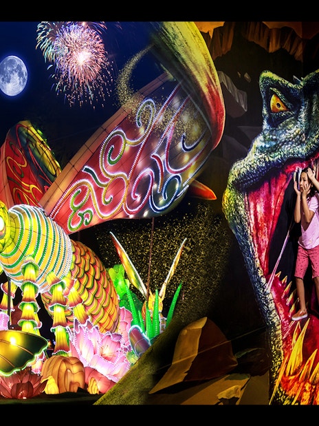 Ain Dubai and Dubai Garden Glow with illuminated butterfly and dinosaur display.