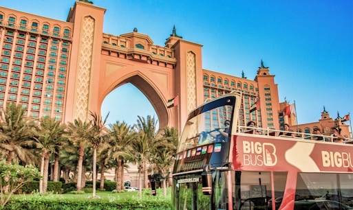 Big Bus tour in Dubai with views of iconic skyscrapers and cityscape.