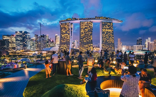 Visitors enjoying the view from Supertree Observatory at Gardens by the Bay, Singapore.