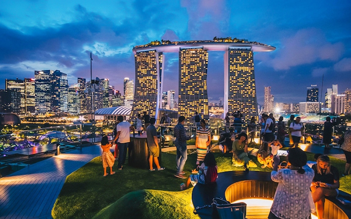 Visitors enjoying the view from Supertree Observatory at Gardens by the Bay, Singapore.
