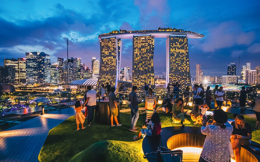 Visitors enjoying the view from Supertree Observatory at Gardens by the Bay, Singapore.