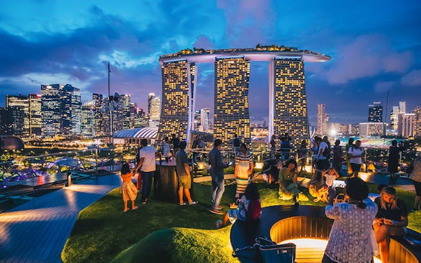 Visitors enjoying the view from Supertree Observatory at Gardens by the Bay, Singapore.