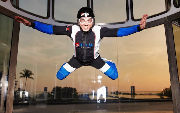 Participant enjoying indoor skydiving at iFly Singapore wind tunnel.