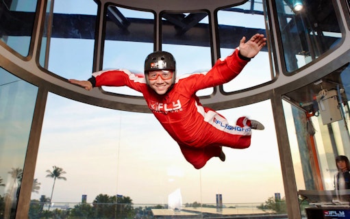 Person indoor skydiving at iFly Singapore.
