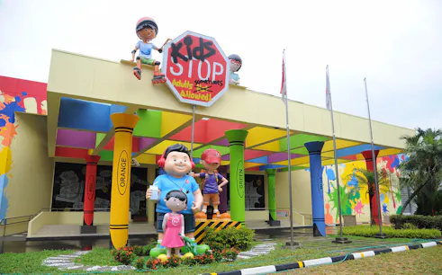KidsSTOP entrance with colorful pillars and cartoon figures in Singapore.