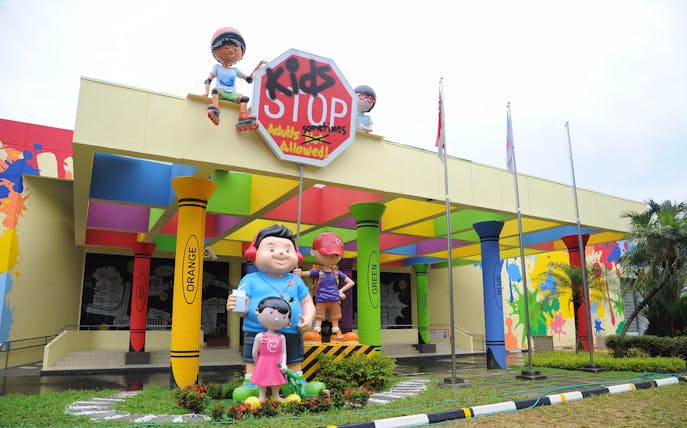KidsSTOP entrance with colorful pillars and cartoon figures in Singapore.