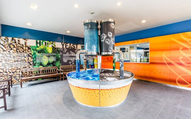 Interactive display at Tiger Brewery showcasing brewing ingredients and process.