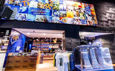 Tiger Brewery Tour gift shop with branded merchandise and beer displays.