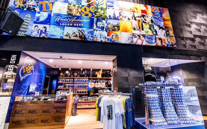 Tiger Brewery Tour gift shop with branded merchandise and beer displays.