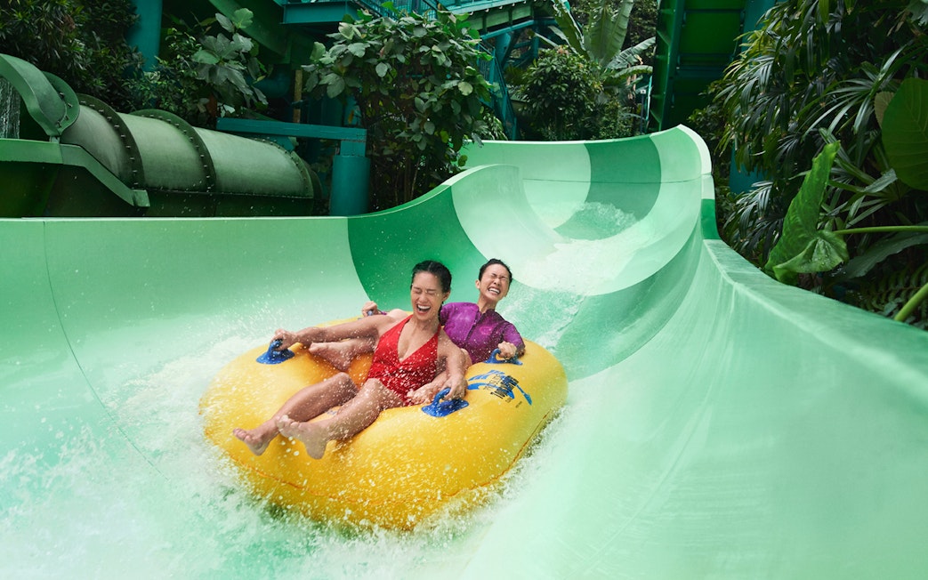 Visitors on the Pipeline Plunge ride at Adventure Cove Waterpark, Singapore.