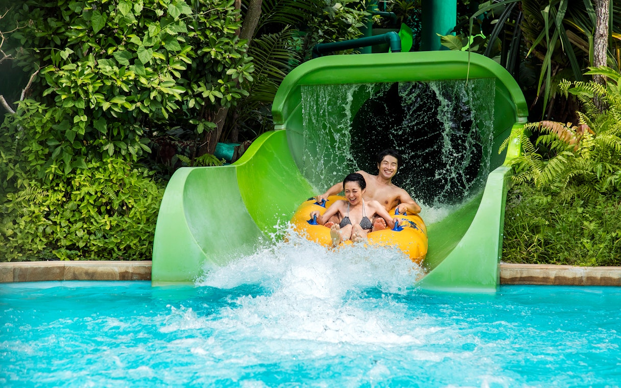 Visitors on the Tidal Twister ride at Adventure Cove Waterpark, Singapore.