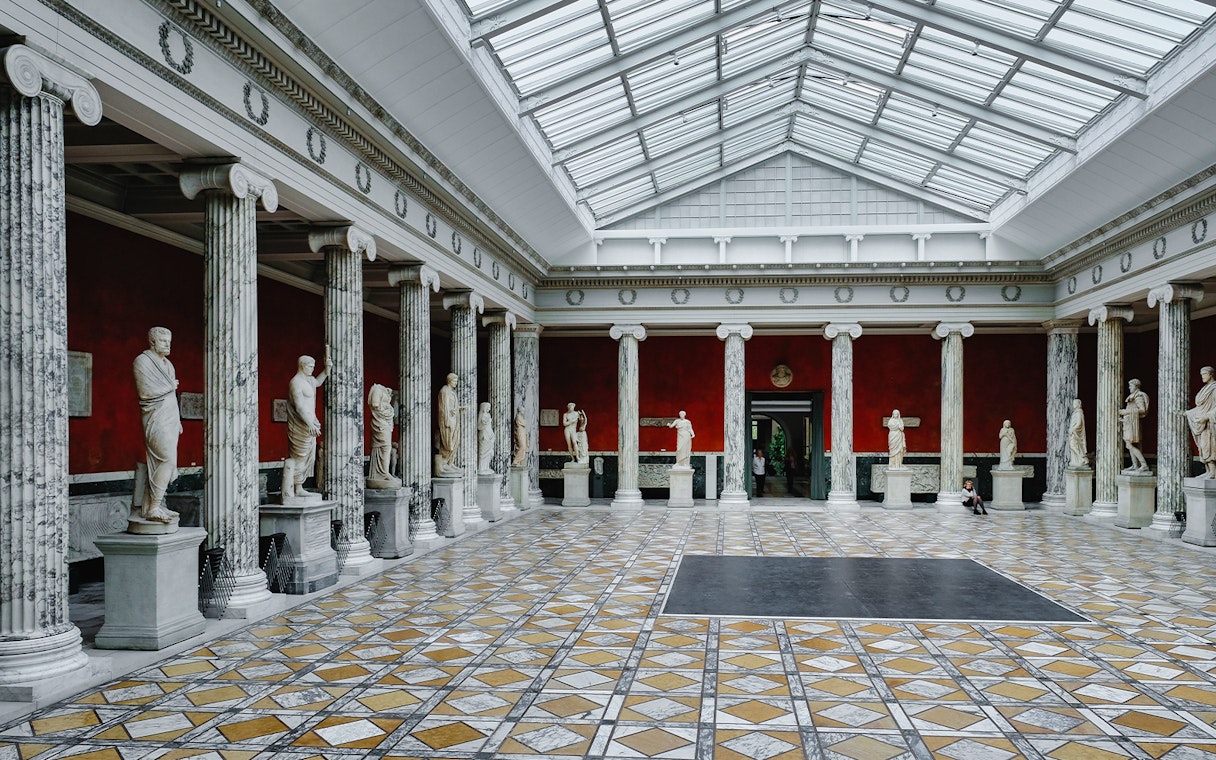 Statues and columns in a gallery hall, Uffizi Gallery, Florence.