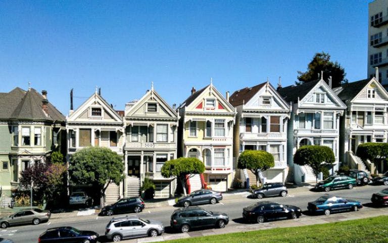 Row of Victorian houses in San Francisco on a sunny day.