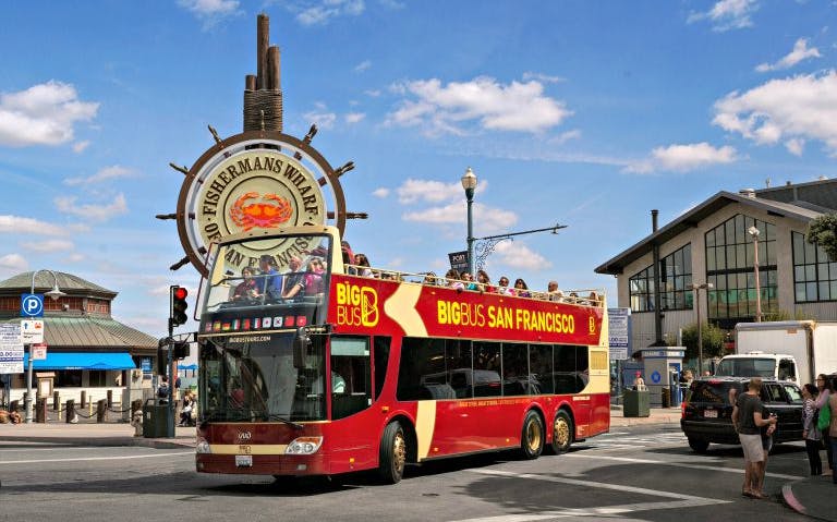 Open-top tour bus at Fisherman's Wharf, San Francisco.