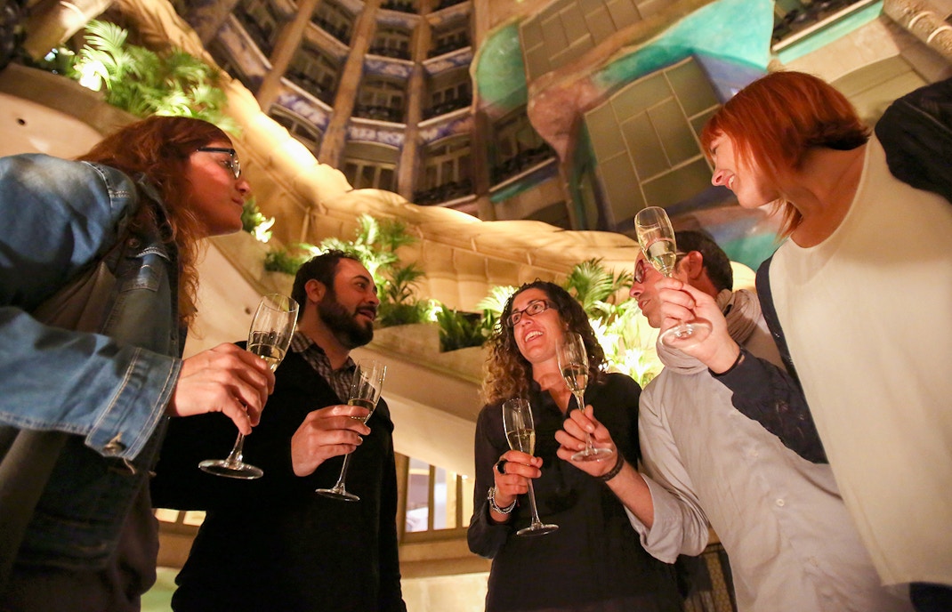 Group enjoying Casa Mila-La Pedrera Night Experience with champagne.