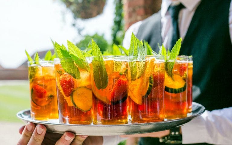 Tray of colorful cocktails with fruit and mint leaves on North Beach Food Tour.
