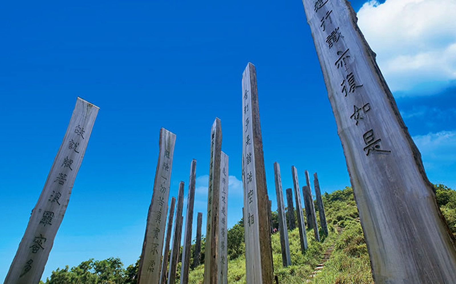 Wooden pillars with inscriptions at Ngong Ping 360, Hong Kong.