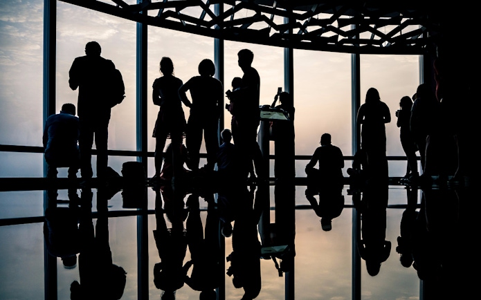 Visitors enjoying the view from Burj Khalifa's Level 124 observation deck.