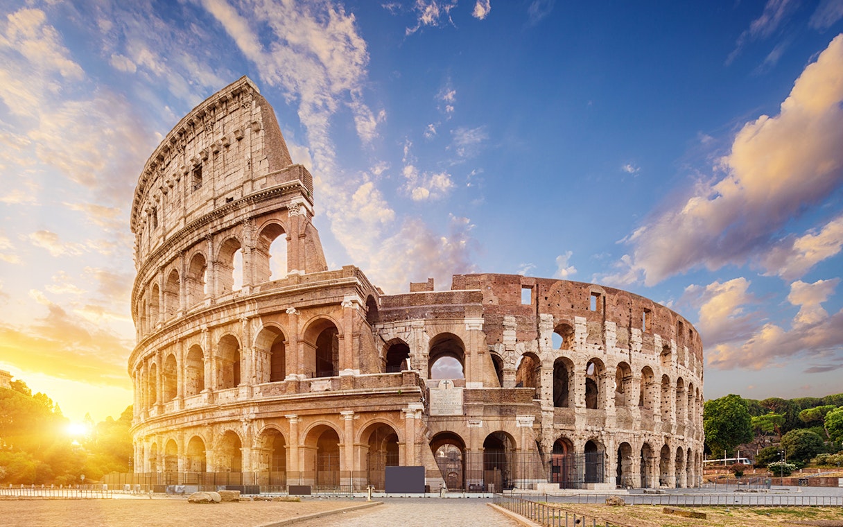 Colosseum in Rome at sunset, part of Combo: Leonardo Express One-Way Tickets + 48-Hr Rome Pass.