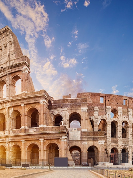 Colosseum in Rome at sunset, part of Combo: Leonardo Express One-Way Tickets + 48-Hr Rome Pass.