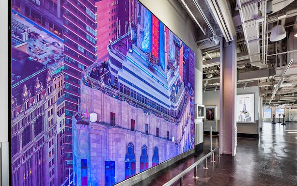 Empire State Building Observatory interior with large display of the building's exterior.