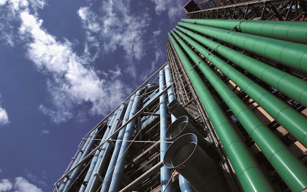 Centre Pompidou exterior with colorful pipes against a blue sky in Paris.