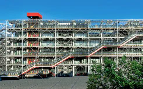Centre Pompidou exterior with visible escalators and modern architecture in Paris.