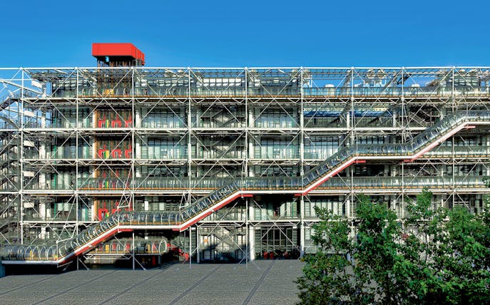 Centre Pompidou exterior with visible escalators and modern architecture in Paris.