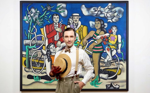 Man in vintage attire in front of Fernand Léger painting at Orsay Museum, Paris.