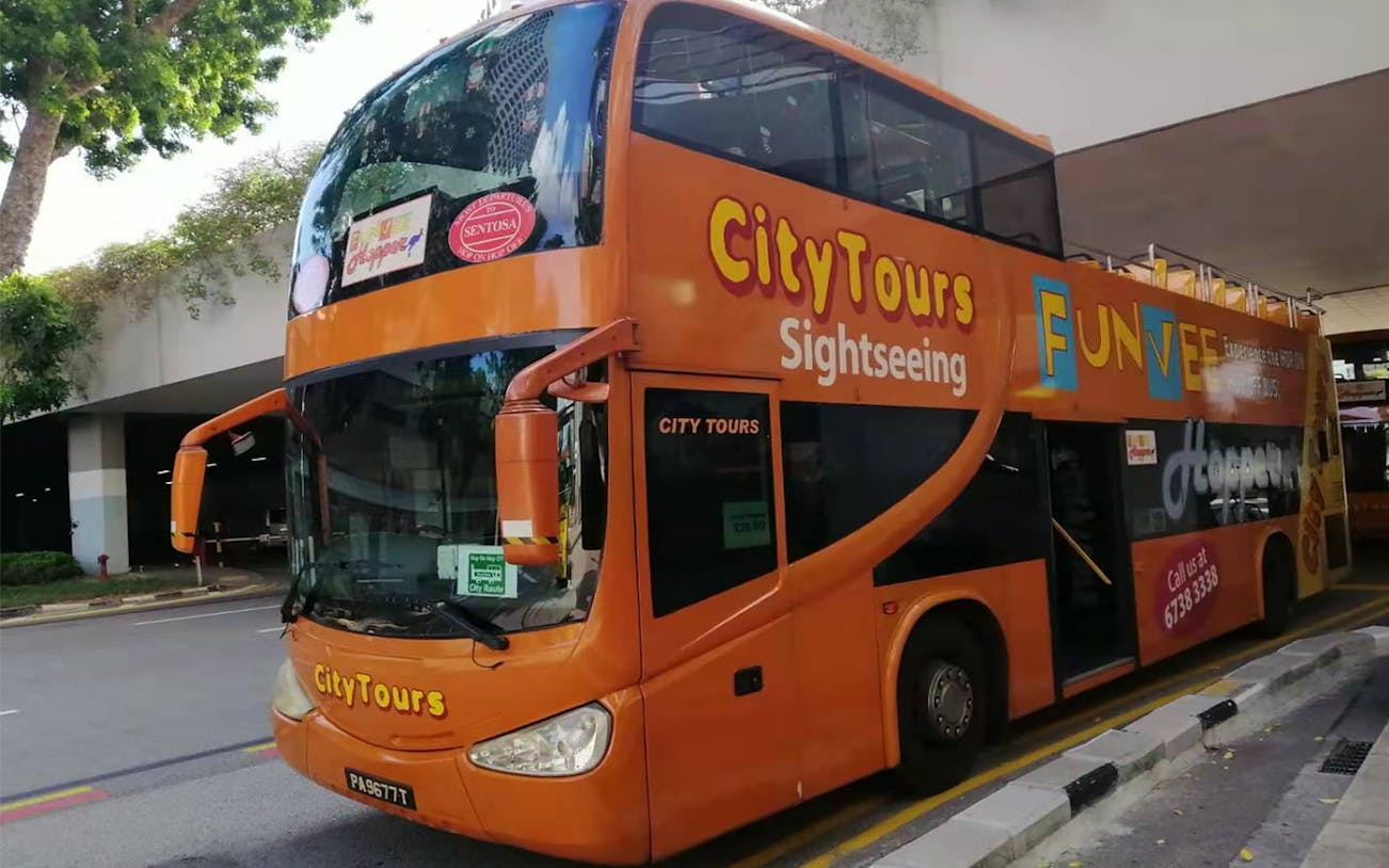 Orange double-decker bus for FunVee Singapore hop-on-hop-off city tour.
