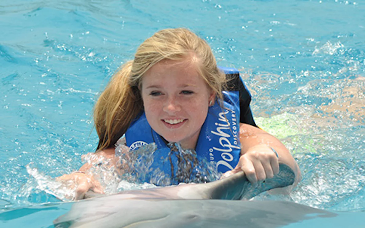 Swimming with a dolphin in Puerto Vallarta adventure experience.