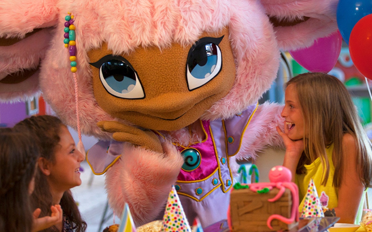 Children interacting with a costumed character at Katmandu Park.
