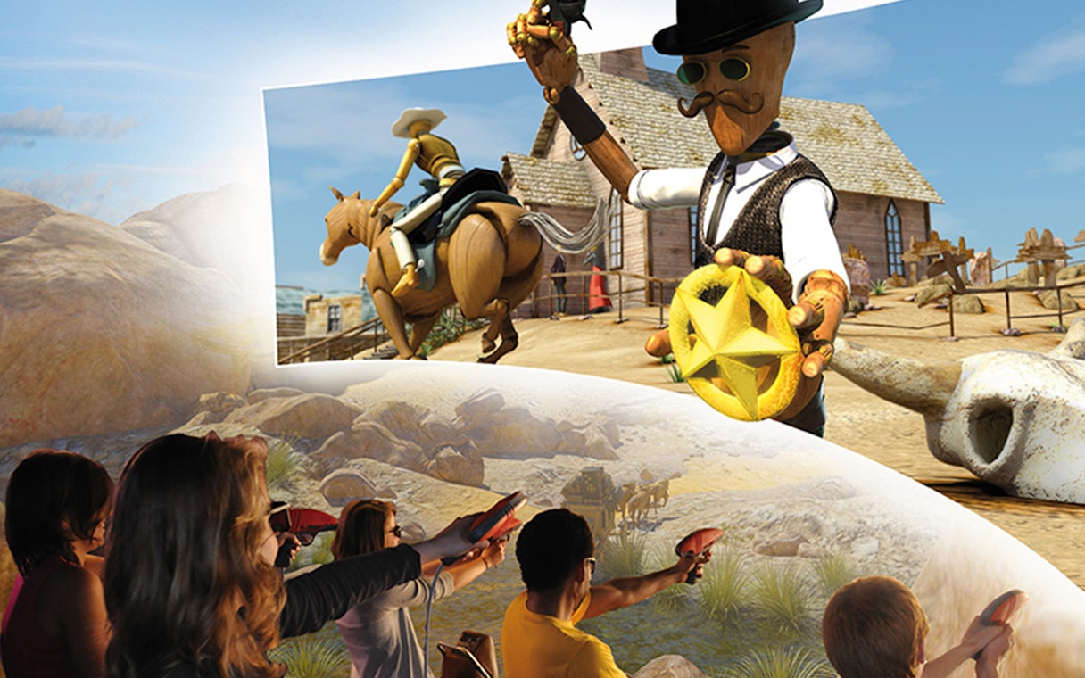 Visitors engaging in an interactive Wild West-themed attraction at Katmandu Park.