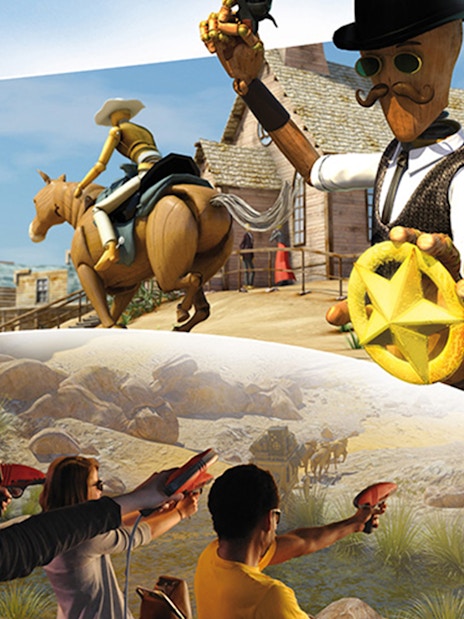 Visitors engaging in an interactive Wild West-themed attraction at Katmandu Park.