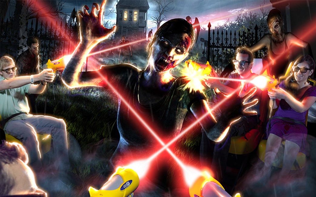 Visitors at Katmandu Park engaging in a zombie-themed laser tag attraction.