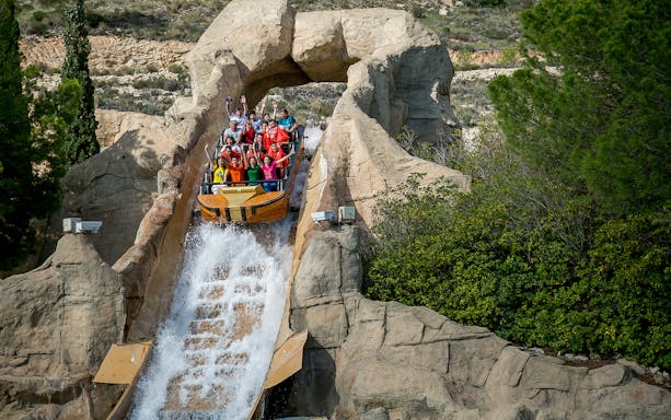 Visitors on a water ride at Terra Mitica, Benidorm, Spain.